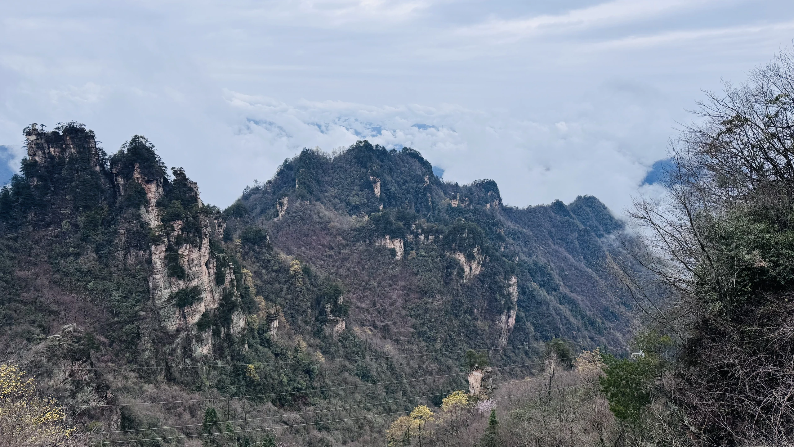 Clouds settling across the mountain ranges of Zhangjiajie, China